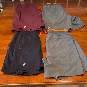 Four pairs of Men's Athletic Shorts - Burgundy, Gray, Black - Fabletics. Size S